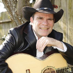 Don Haley playing the guitar at home